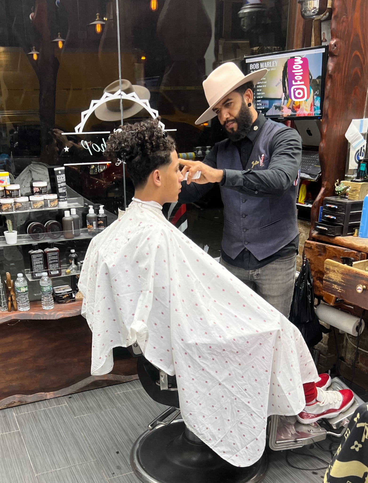 Julio cutting hair at vivo hairstudio, Inwood NYC