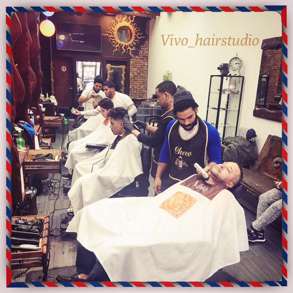 Julio giving a classic hot-towel straight-razor shave at vivo hairstudio