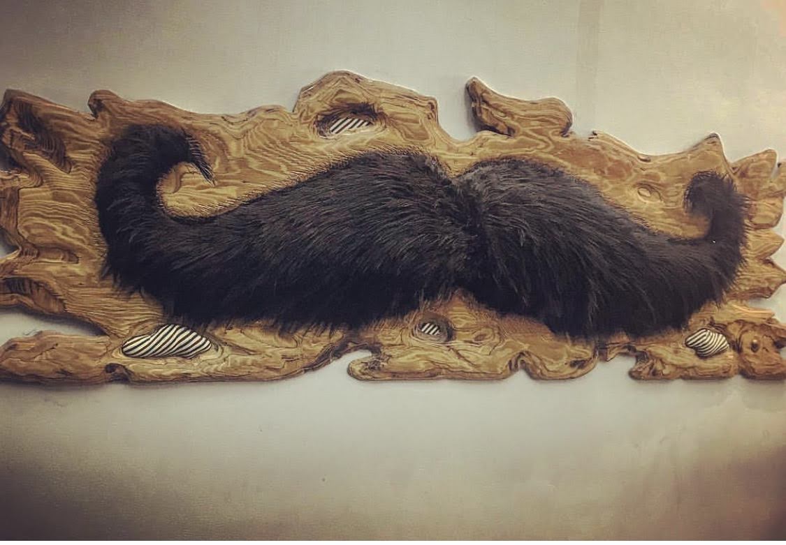 Vintage mustache wall plaque inside vivo hairstudio