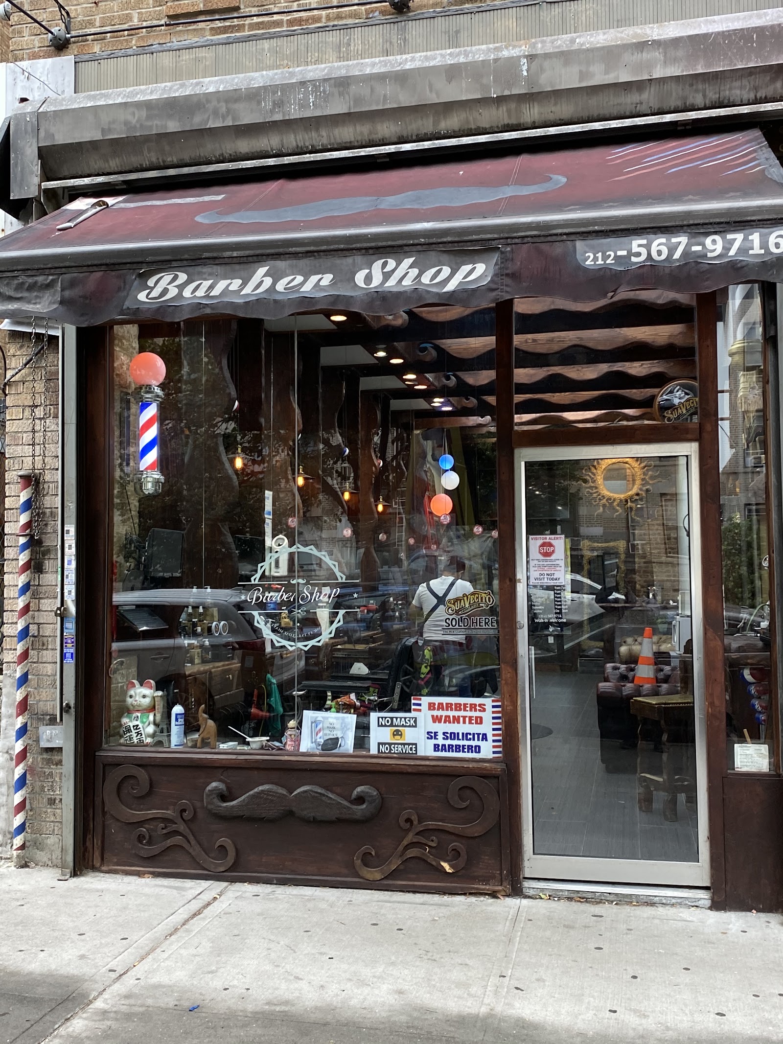vivo hairstudio storefront with striped awning on Sherman Ave